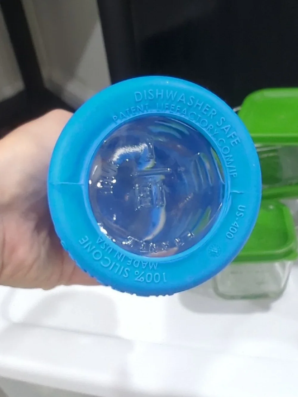Glass Food Storage Set with Green Lids and Assorted Silicone Bottles
